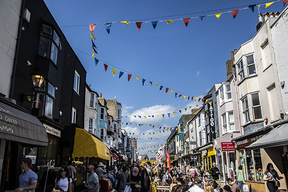 Busy Brighton back street with colourful bunting