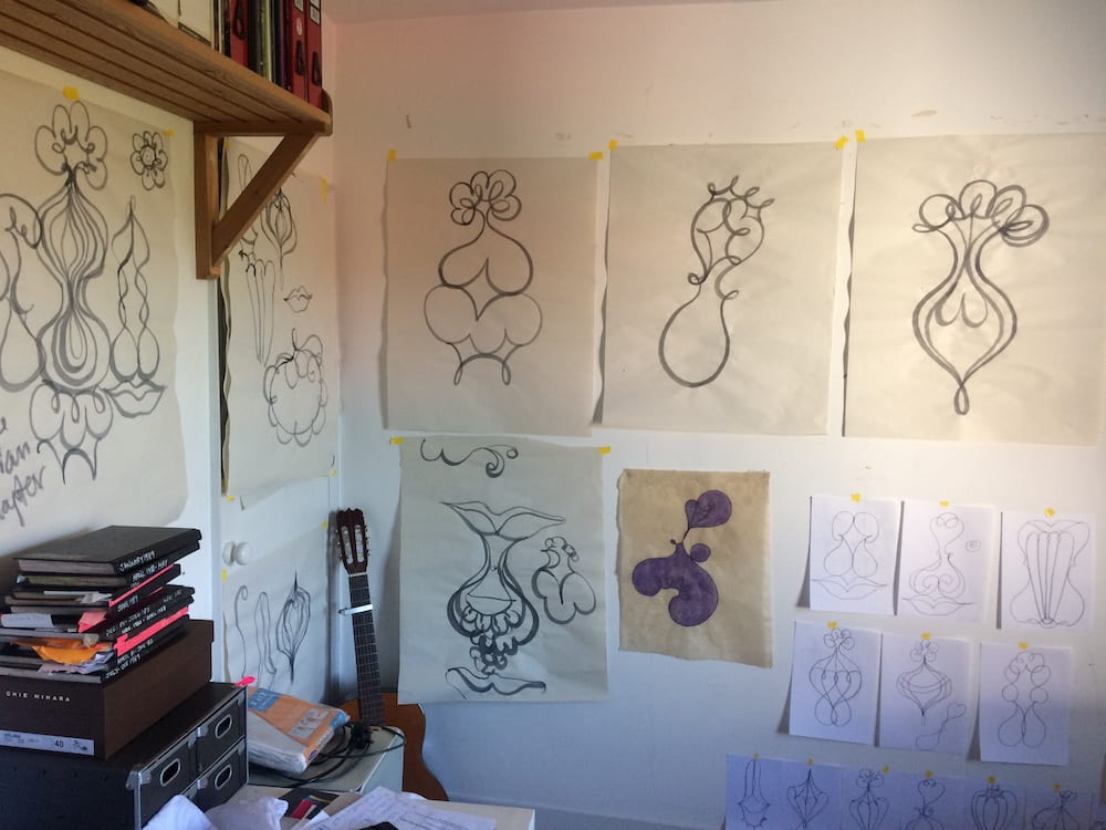 studio wall with drawings on it