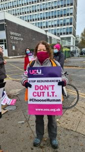 Staff on picket line holding 'Don't Cut IT' placard