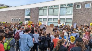 Large crowd outside Cockcroft building, Brighton Uni