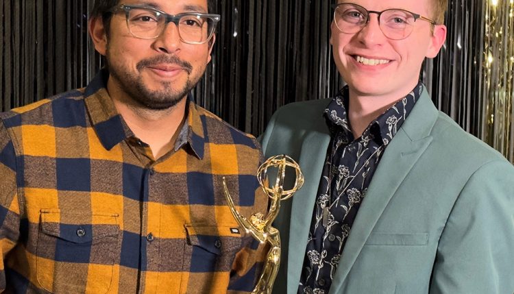Jordan Hogan (right) with Emmy award